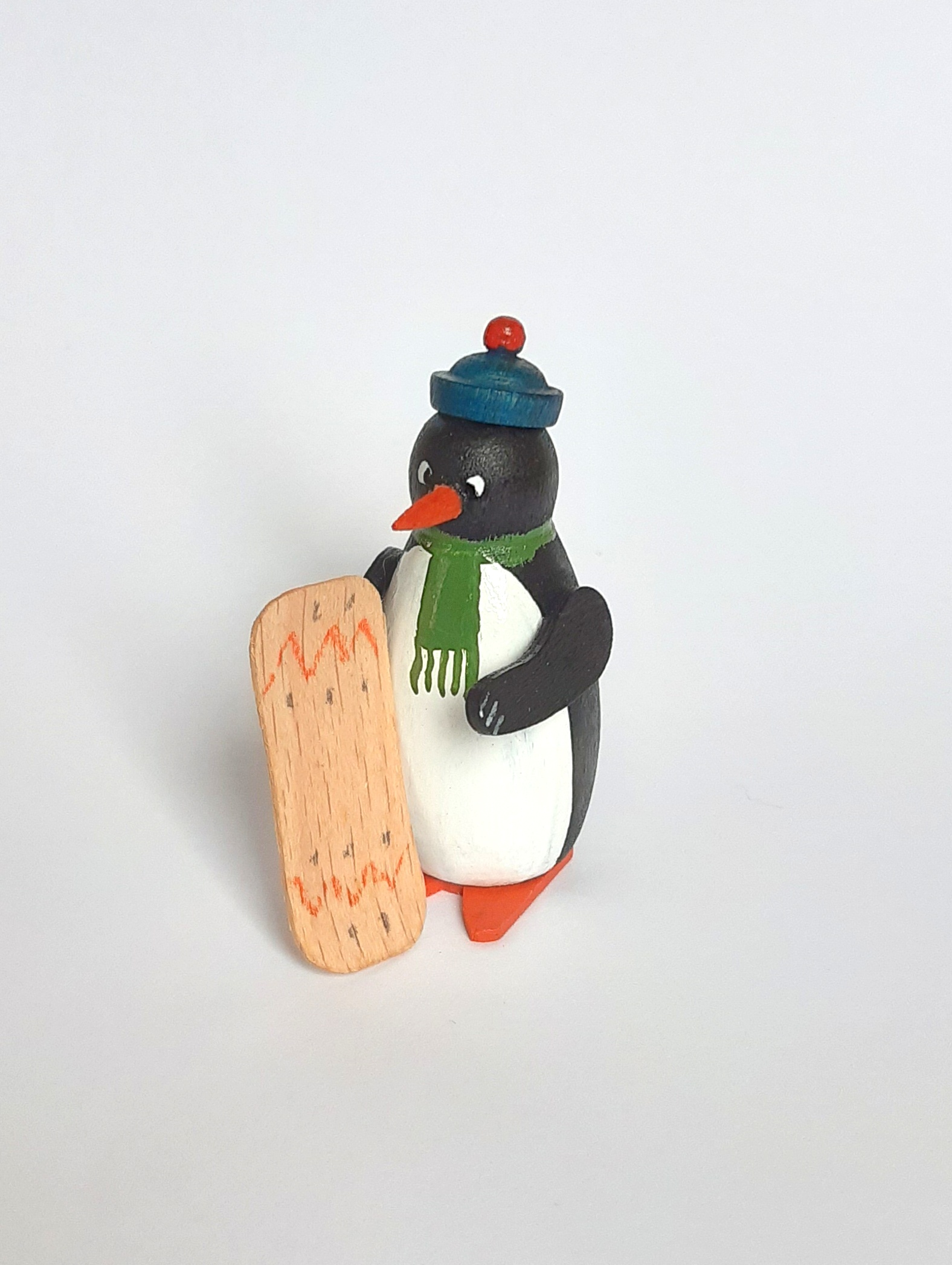 Pinguin mit Snowboard